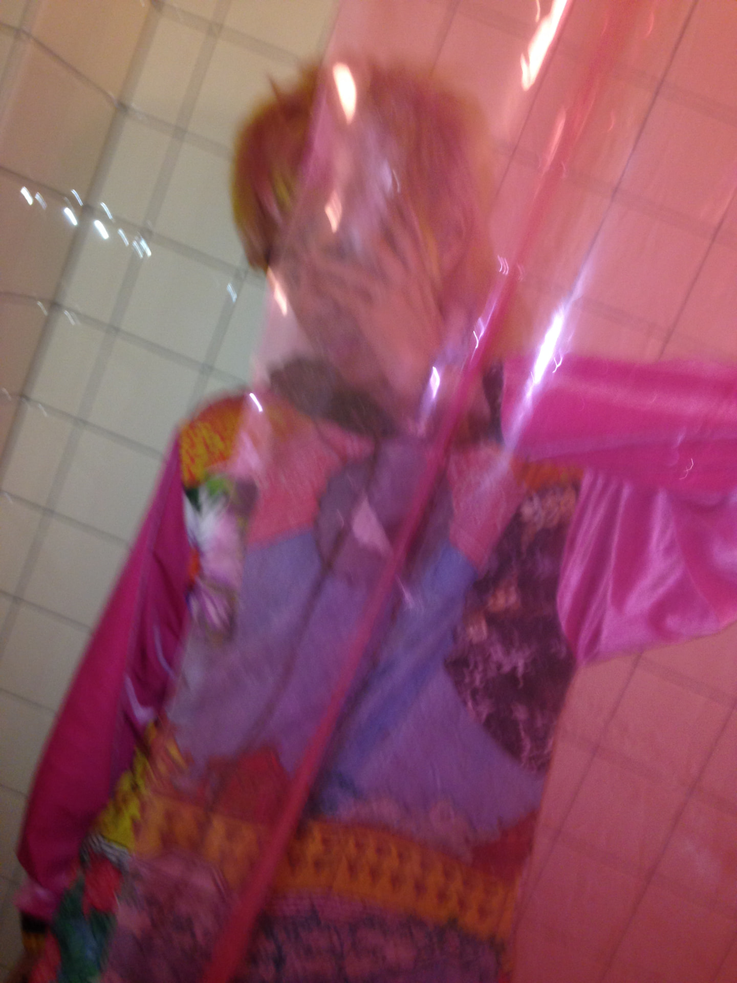Blurred pink-lit portrait of Lan in motion