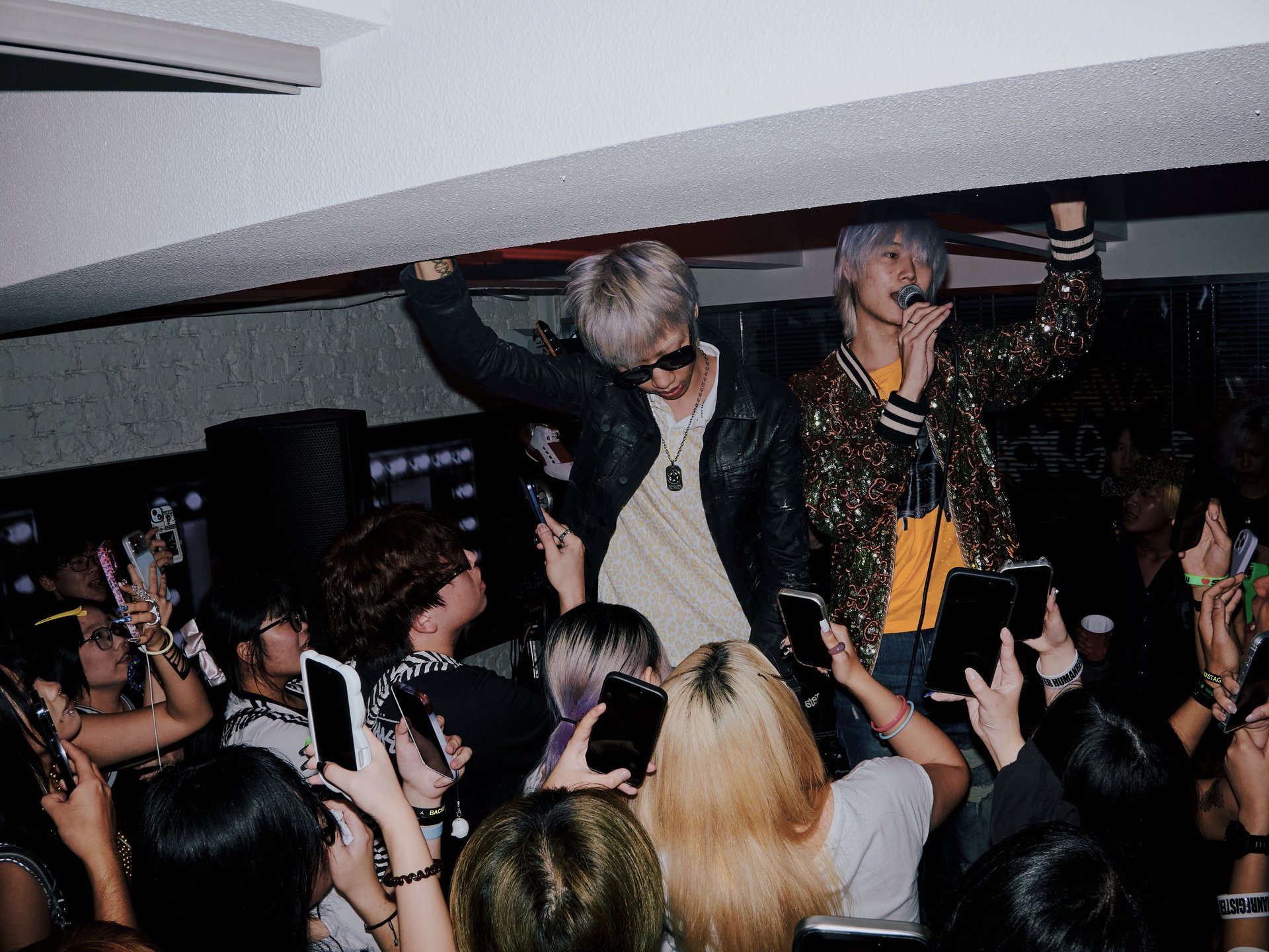 Taco and Skiboyvv performing surrounded by fans in Shanghai