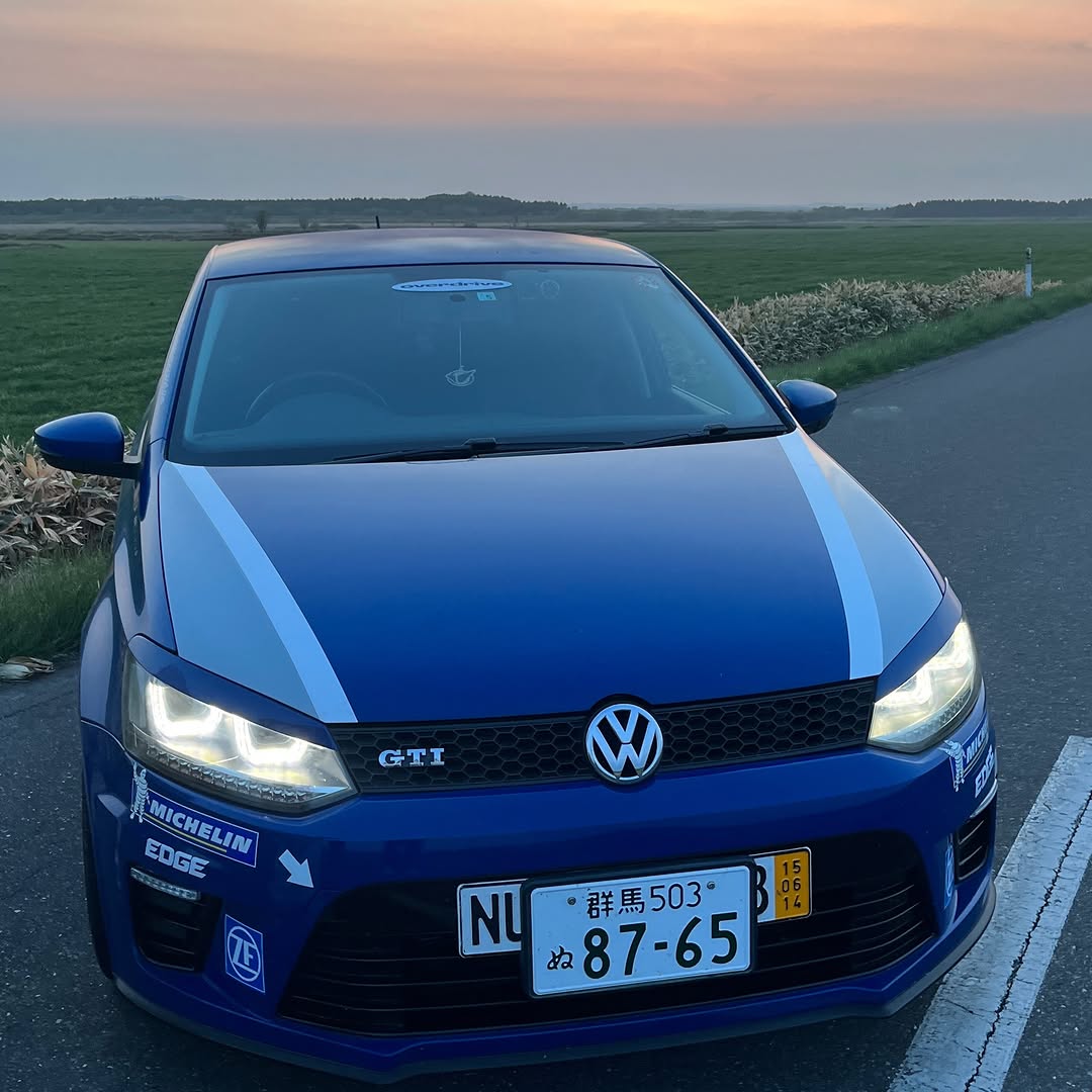 Blue Volkswagen GTI at sunset