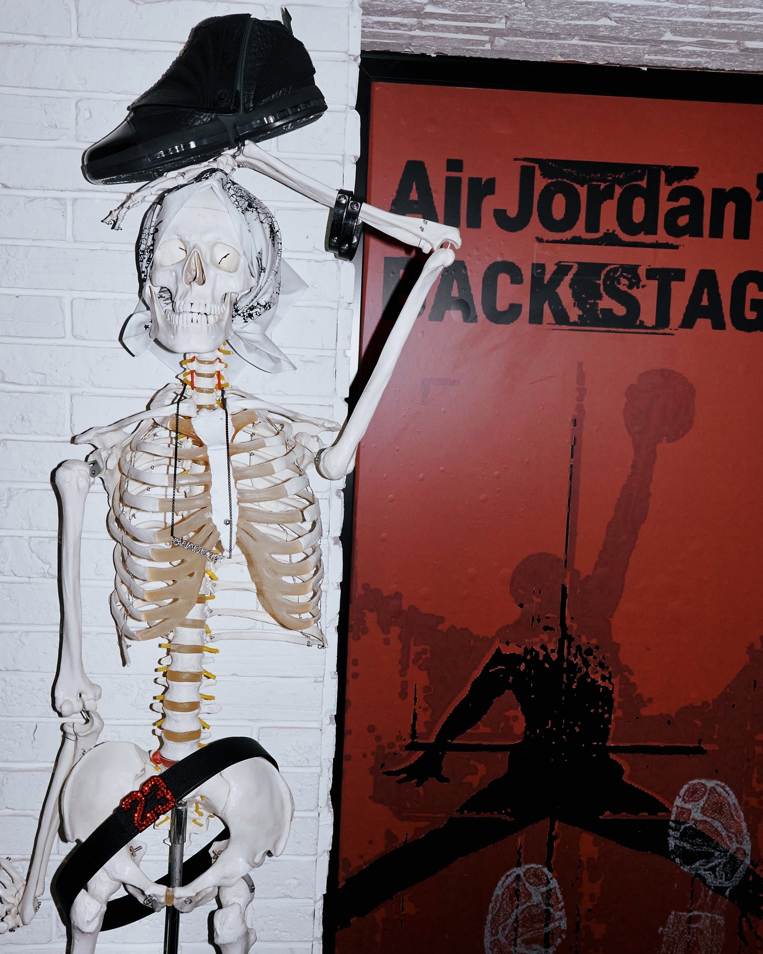 Skeleton wearing Human Register accessories beneath an Air Jordan shoe